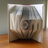 Pages of a Book Folded as Mom